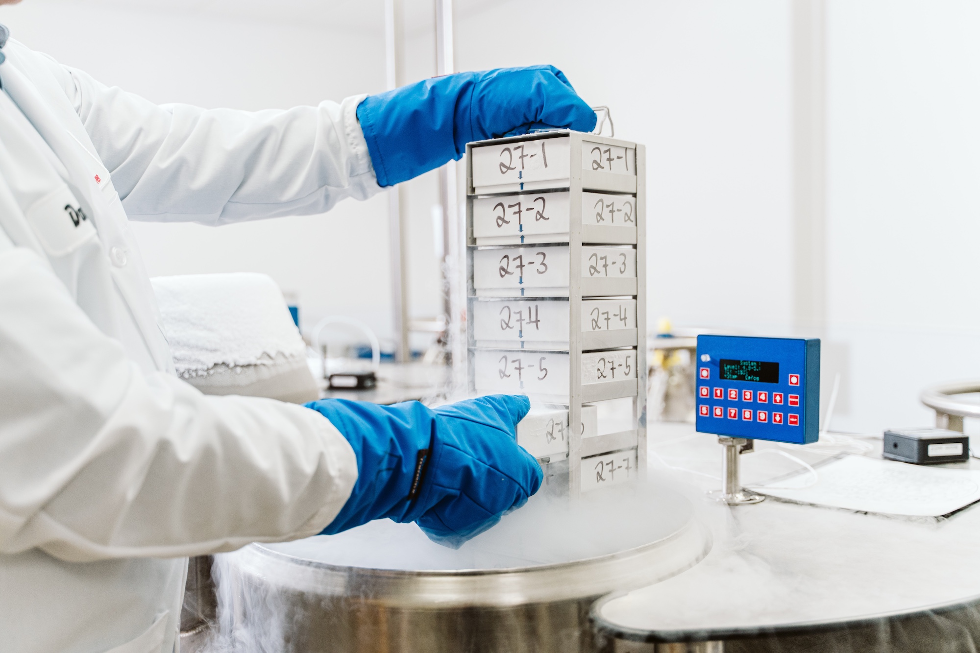 A WiCell scientist extracting a storage container filled with stem cells
